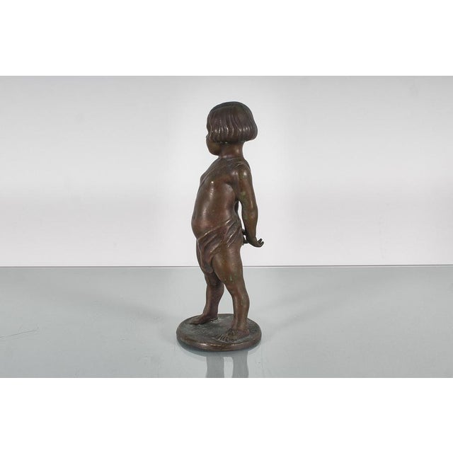 Goldenrod Sculpture of a Child with Arrows in Bronze, 1922 For Sale - Image 8 of 14