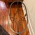 Gorgeous heavy forged (probably iron or bronze) metal base with beveled glass top. In the style of Dennis and Leen Cap...