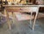 An authentic, rustic late 18th-century French Provincial fruitwood single-drawer side table or occasional writing desk....