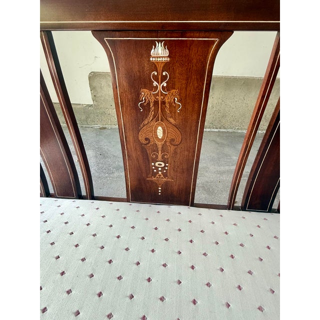 Bring a touch of late 19th-century elegance into your home with this exquisite, professionally restored mahogany settee....