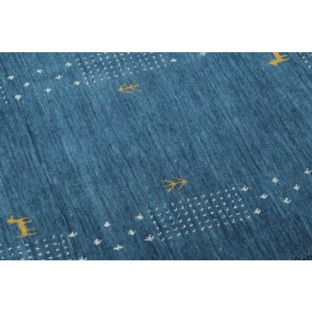 Hand-knotted in wool, this 2x3 contemporary gift-sized rug joins Rug & Kilim’s Modern collection. Featuring saturated teal...
