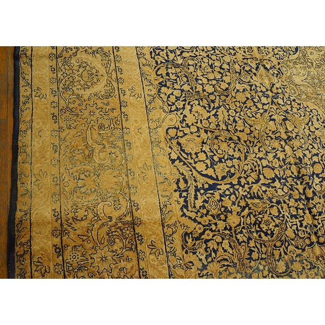 Early 20th Century Traditional Floral-Medallion Design on Navy Background and Camel Border Color Antique Persian Kirman Rug For Sale - Image 5 of 7
