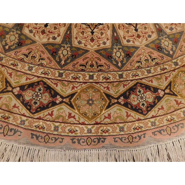 Central medallion surrounded with architectural motifs, creating an amazing circular effect. Style: Tabriz Country of...
