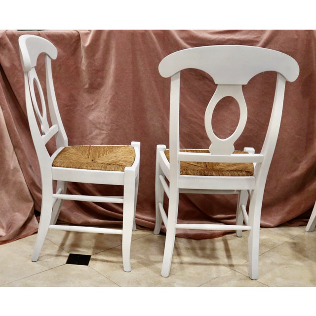 Vintage Pottery Barn White French Provincial Dining Chairs with Rush Seats made in Italy - Set of 6. Solid, sturdy Frame...