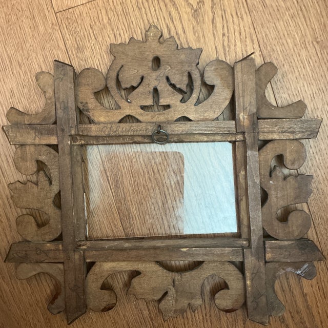 Antique Hand Carved Black Forest Picture Frame with an Oak Leaf surround with flowers at each corner. The back is...