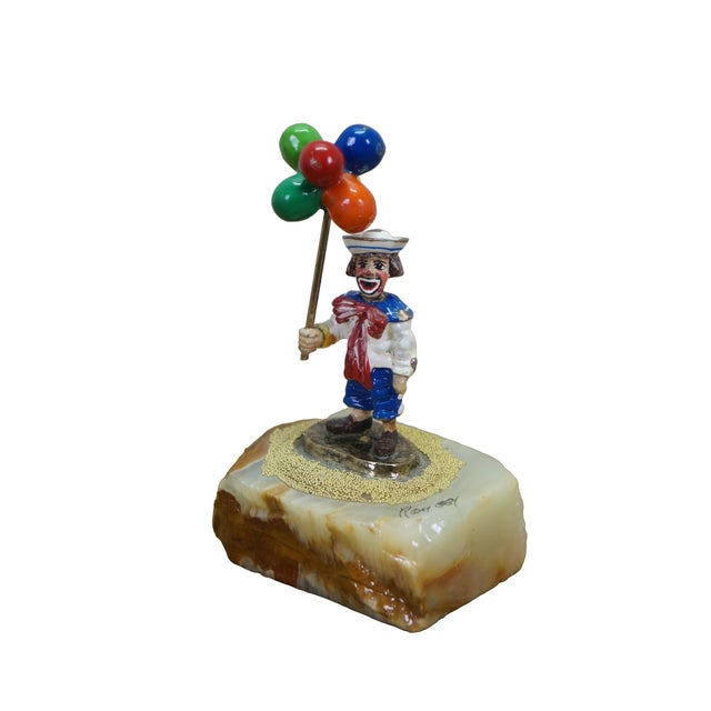 Vintage Ron Lee clown figurine featuring a cast metal clown dressed as a sailor holding a bundle of a balloons, mounted on...