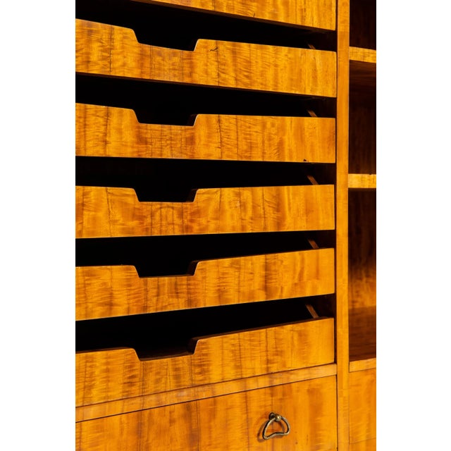 This is a unique cabinet in rosewood, brass and burlwood. It was produced in Sweden in the 1940s.