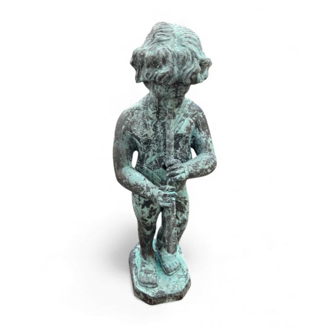 Add a touch of pastoral charm and musical tranquility to your garden or interior space with this captivating Piping Boy...