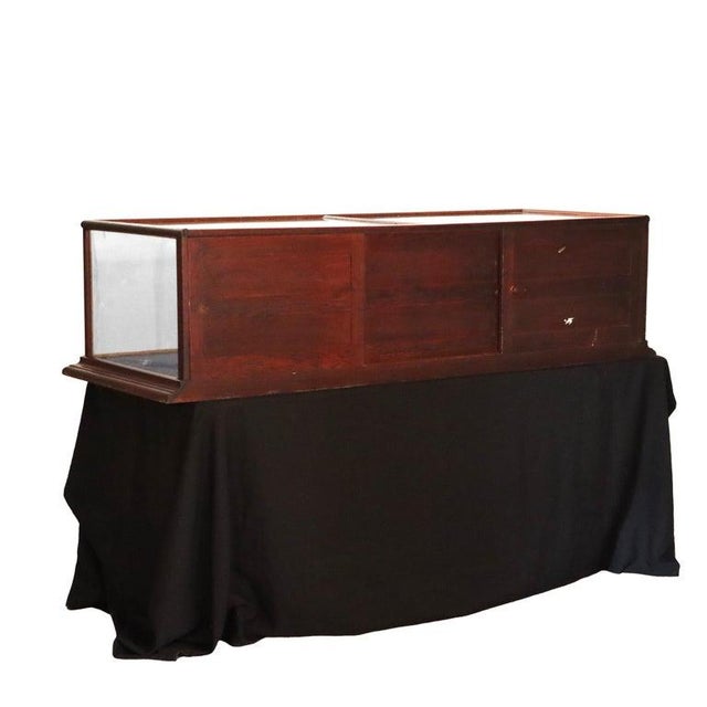 This antique country store display case, by Chas Bodach and dating to circa 1900, presents an example of early 20th-...