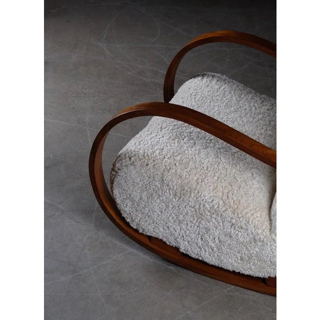 Reupholstered in sheepskin. Produced in Sweden, 1950s.
