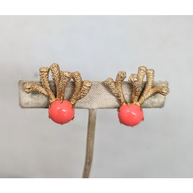 1960s textured goldtone "coral" with cabochon faux-coral rhinestone clip back earrings. Marked "Napier." Measure: 1 inch...