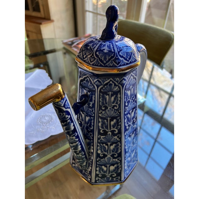 Up for your consideration is this stately and tall blue and white teapot which serves as a table top statement decorative...