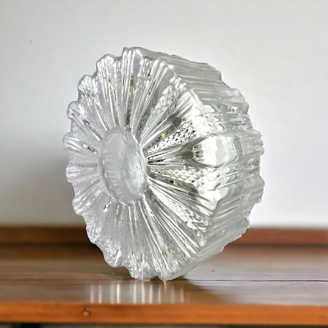 Pair of 1960s flush mount lamps made of clear glass. The round one is made in portugal and a square one in spain. the...