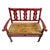Vintage small teak hall bench from India with red painted and carved back, arms, and legs. Natural wood tone seat....