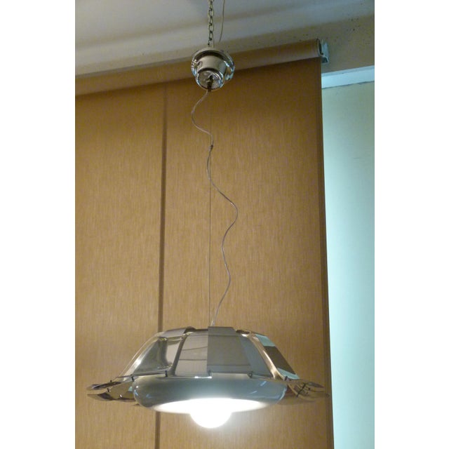 This chandelier was restored inside, repainted, rewired and cleaned with paste. This piece is attributed to the mentioned...