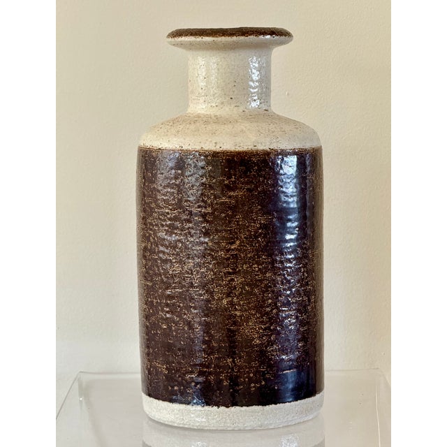 A stoneware ceramic vase in earthen tone glazes. Signed on the underside Soholm, Denmark. Quality Danish workmanship from...