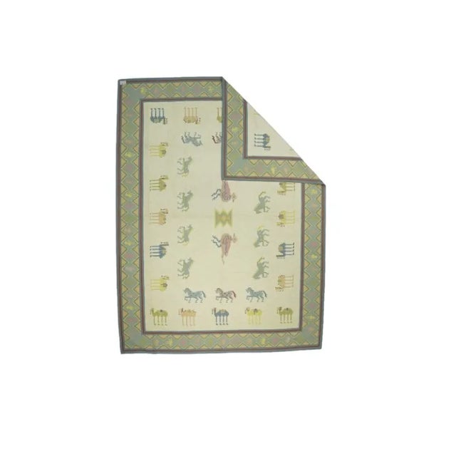 This 10x14 rug is a rare vintage Dhurrie rug from an exciting new mid-century curation by Rug & Kilim. Handwoven in a...