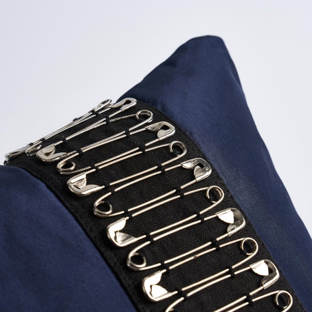 This pillow features Punk Rock Mix Tape by Johnson Hartig/Libertine for Schumacher with a knife edge finish. Sid Vicious...