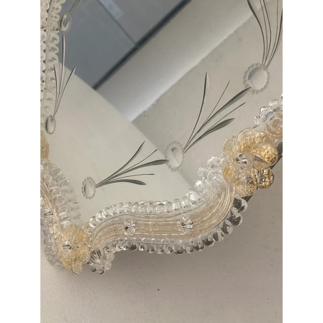 Venetian floreal table mirror in Transparent and Gold Murano Glass with hand-made engravings. Flowers pinched by hand full...