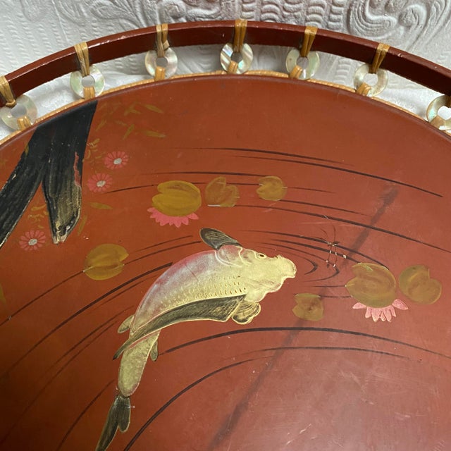 A gorgeous hand painted fish Japanese Lacquerware round tray, decorated on the edge with beautiful mother of Pearl...