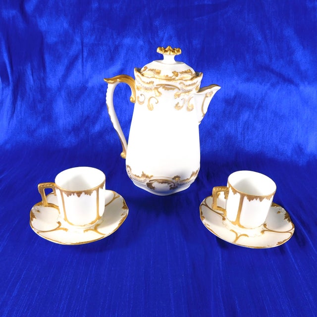This is Vignaud Feres Limoges Chocolate pot. It is white bisque with a matte finish and a lot of gold trim. It comes with...