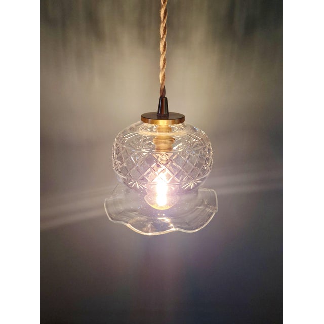 Early 20th century scalloped clear crystal pendant/lamp. Each pendant has been restored and rewired and is compatible with...