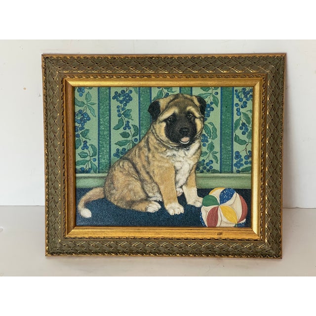Puppy dog sitting with his ball oil painting on board, framed in gold tone frame.