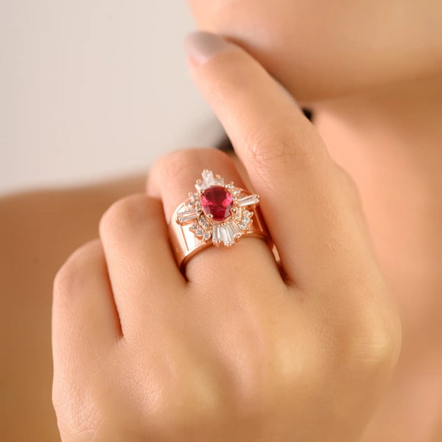 Add a touch of timeless glamour to your collection with this stunning rose gold finish silver ring, featuring a radiant...