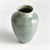 In a modern silhouette with a subtle linenlike texture, reactive glaze and high gloss finish, this ceramic vase is a...