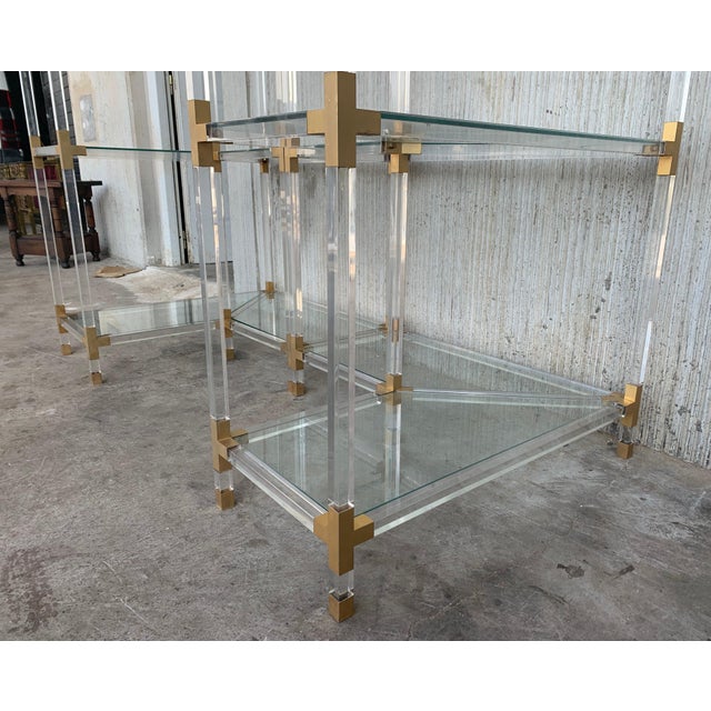 Midcentury brass, Lucite and glass corner étagère. Five shelves We have four corner étagères available (Three with...