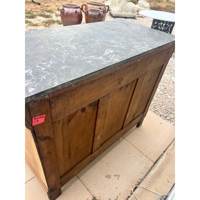 A beautiful 19th-century French Louis Philippe commode, crafted in richly figured burl walnut veneer and topped with its...