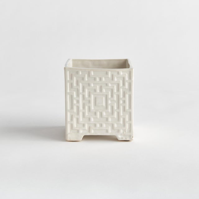 This clean,White cachepot is made in traditional style. With unmistakable chinoiserieinspired lattice details, it is sure...