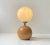 Unusual and sculptural modern table light executed with a large solid sphere in beech wood and featuring a similar sized...