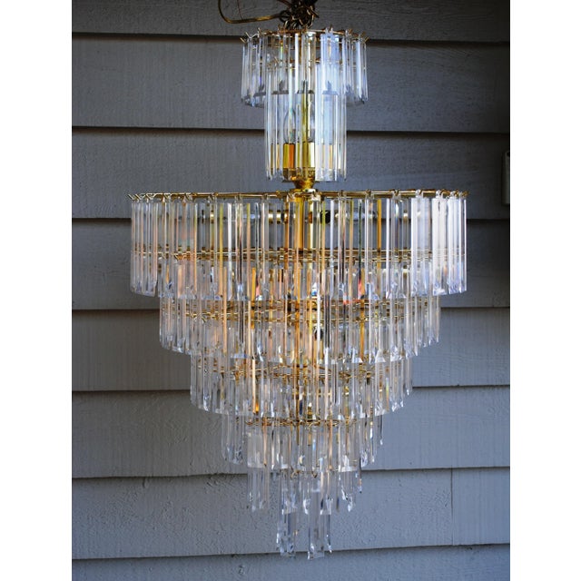 Hollywood Regency Style Lucite Chandelier, wedding cake style, with 8 individual tiers of lucite "crystals". This is a...