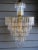 Hollywood Regency Style Lucite Chandelier, wedding cake style, with 8 individual tiers of lucite "crystals". This is a...