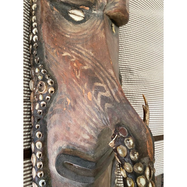 This striking vintage Sepik River mask from Papua New Guinea features classic Middle Sepik artistry with an elongated...