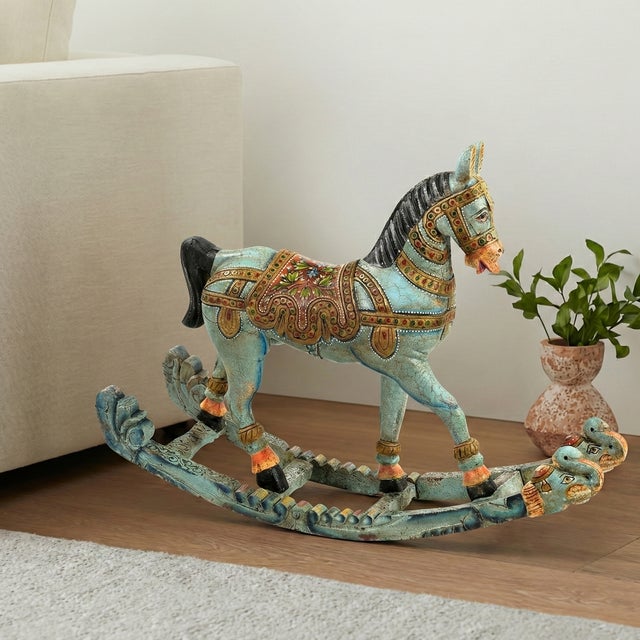 Dimensions: 42" W x13" D x 31" H This vintage rocking horse sculpture is a decoarative piece of art that can enhance a...
