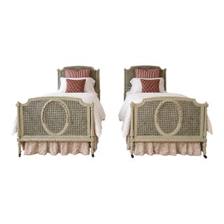 Pair of Antique French Louis XVI–Style Painted Cane Twin Beds With Carved Floral Medallions | 1900 For Sale