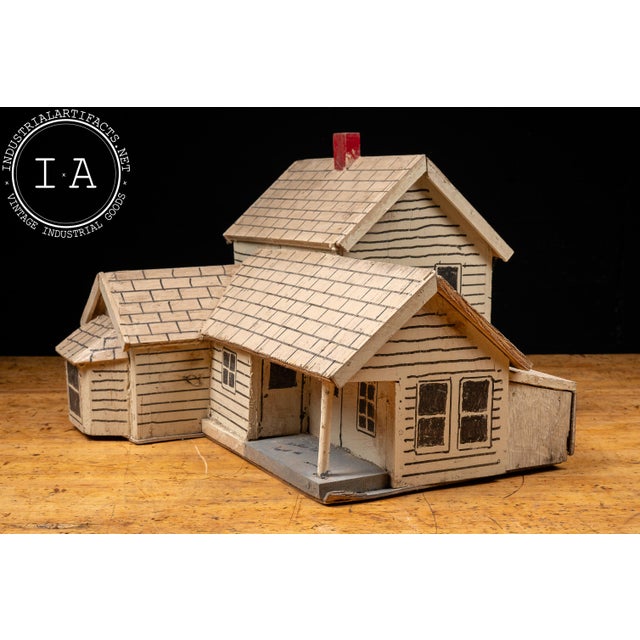 Handcrafted architectural folk art house model constructed from wood with hand-drawn architectural details throughout. The...