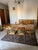 Wooden table with 6 wooden chairs and green upholstery produced by Valzania. Very good condition, requires light...
