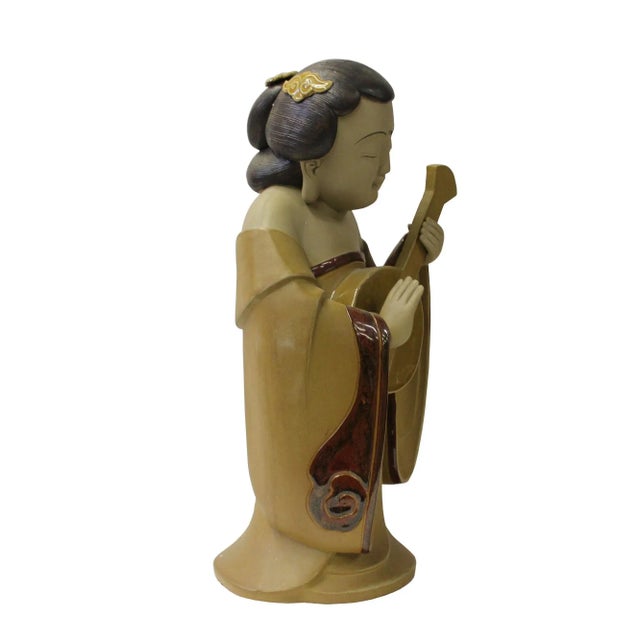 This is a Chinese decorative ceramic pottery figure of Tong style lady in modern enhanced design. Dimensions: Dia 8.5"x...