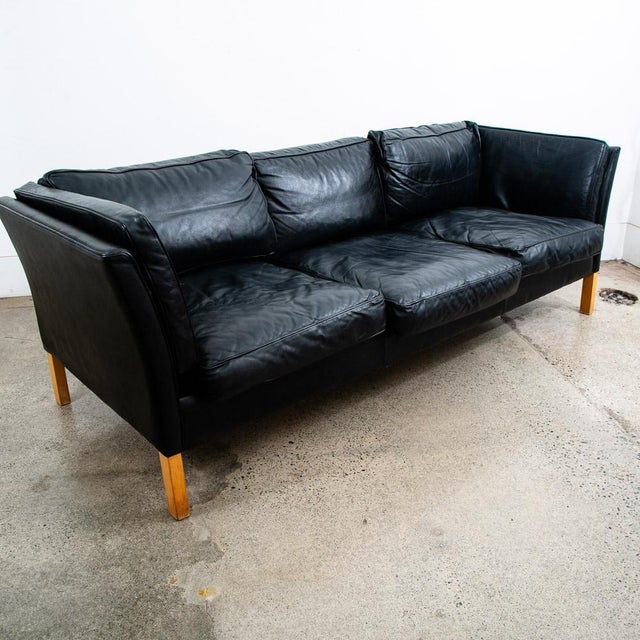 High quality early black leather Danish modern 3 seater sofa / couch .This piece was imported directly from Denmark in our...