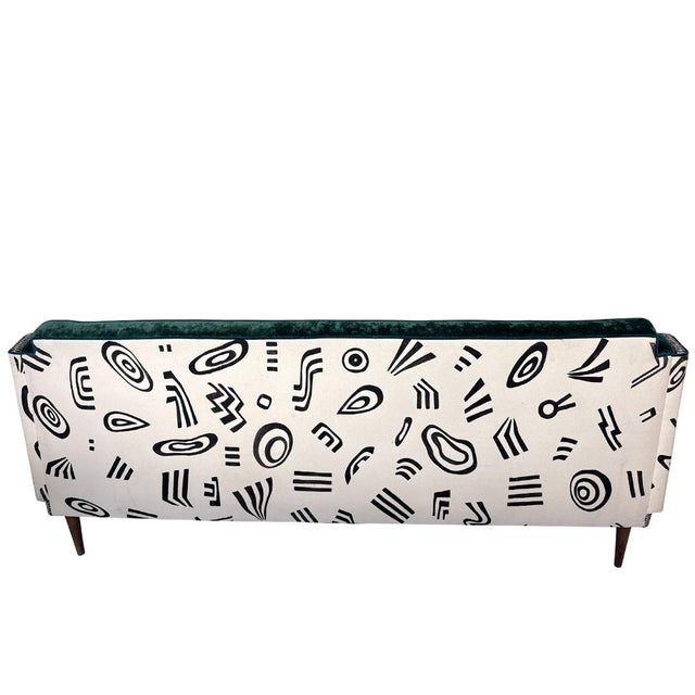 This is a one-of-a-kind, reupholstered Mid-Century Modern (MCM) vintage couch brought to life with a mix of textures,...
