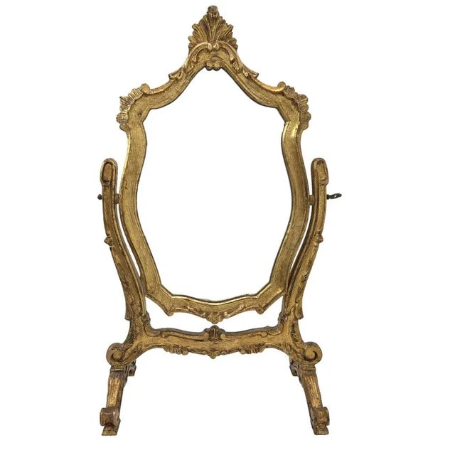 1930s Venetian gilded wood table mirror with tilting mirror. Very decorative Rococo style and in a beautiful condition!...