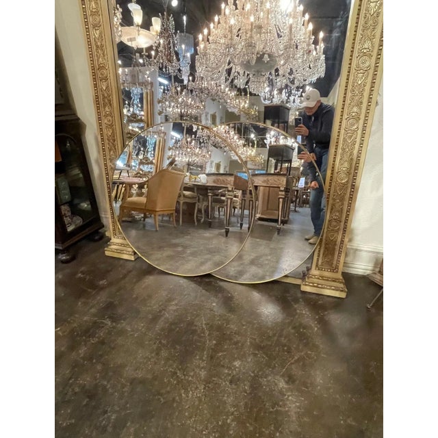 Gorgeous pair of round brass mirrors from Italy. Very fine quality and great for a variety of decors. Note: Price listed...