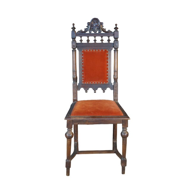 This set of six antique, high-backed dining chairs features an ornate Renaissance Revival style crafted from dark, heavily...