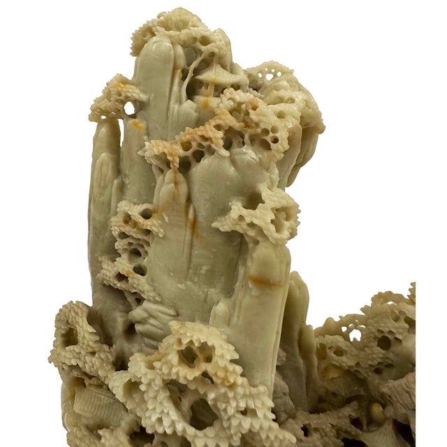 This is a vintage Chinese mountain village sculpture hand-carved from soapstone, featuring intricate pagoda landscapes....