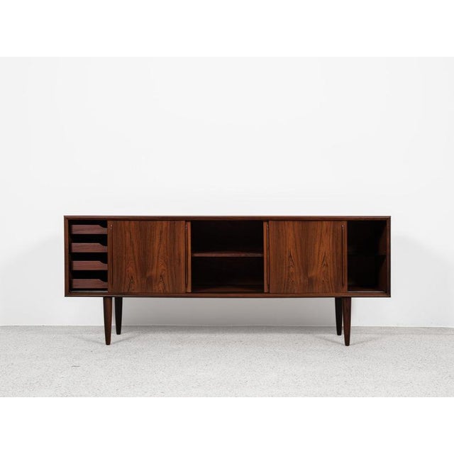 This sideboard is designed by Svend Aage Madsen and manufactured by HP Hansen in Denmark in the 1960s. It shows good...