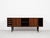 This sideboard is designed by Svend Aage Madsen and manufactured by HP Hansen in Denmark in the 1960s. It shows good...