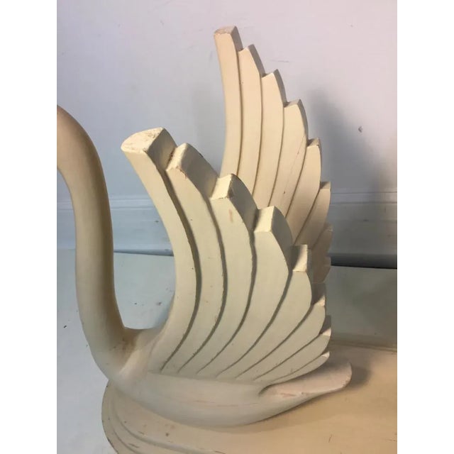 Beautiful 1970's Modern Double Swan Console Base Comprised of Carved Wood With Ivory Enamel Finish. The Glass Top is a...